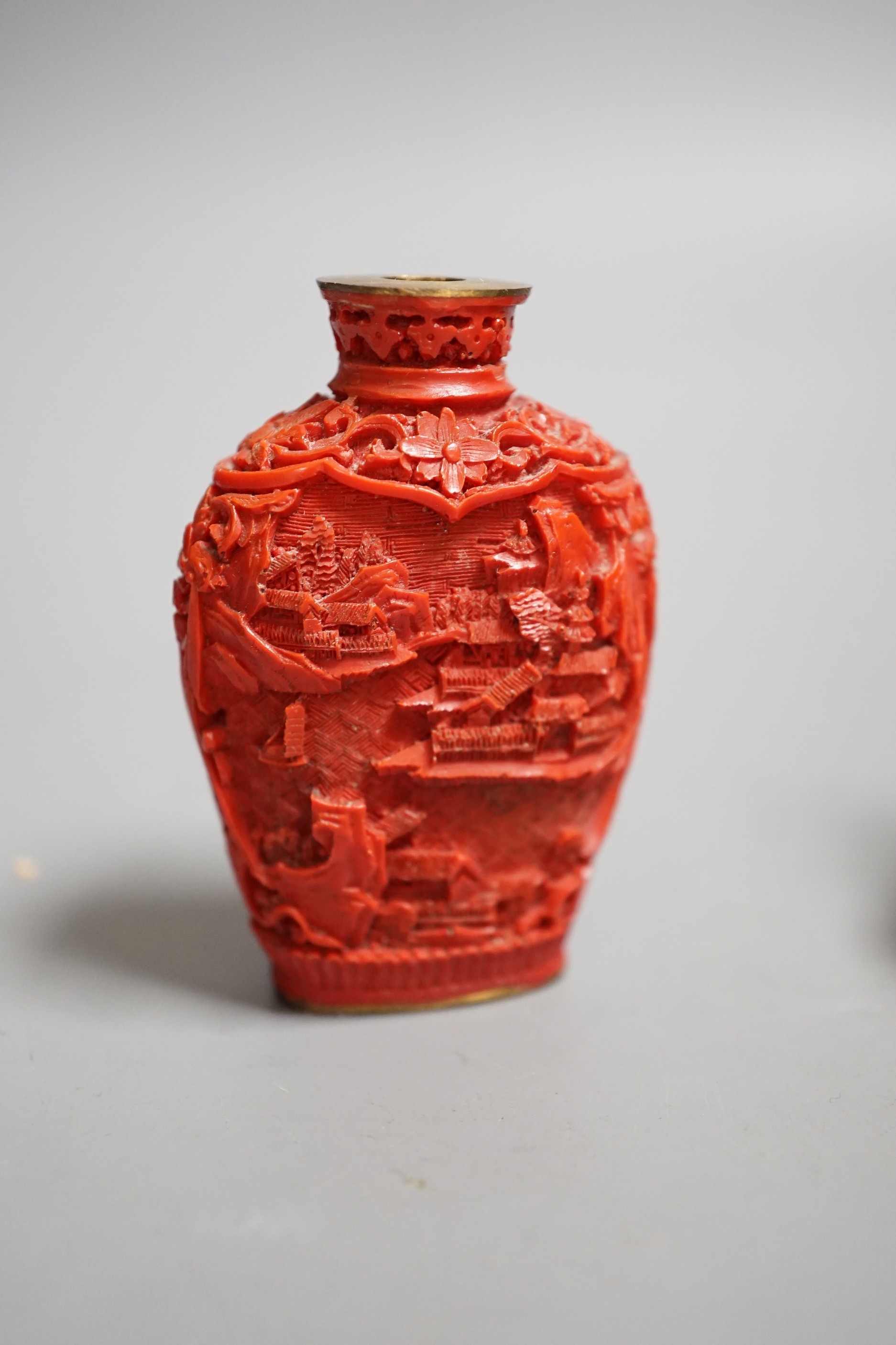 A Chinese resin snuff bottle, a resin Buddha on stand and a resin netsuke